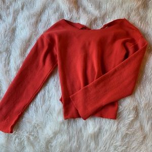 Red sweater with ties in back